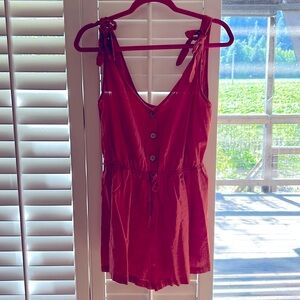 NWOT 100% linen romper with wooden buttons. Bought from Vici and never wore